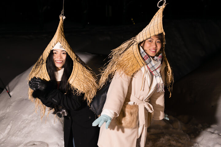 Girls wearing traditional snow coat