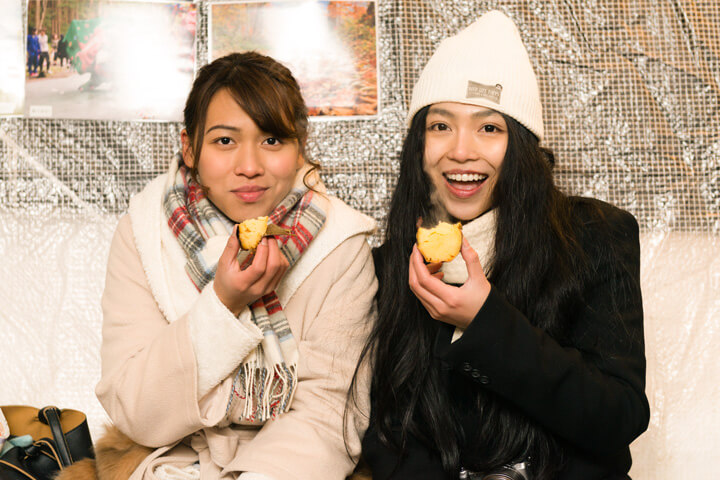 Girls eating sweet potato look so happy
