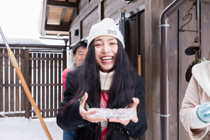 Cheerful girl got an icicle