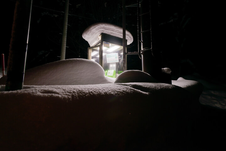 A snow-covered phonebox