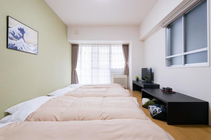 Futon bed room decorated with ukiyoe